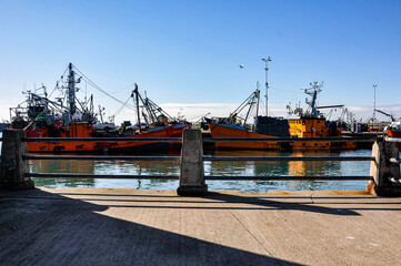 Two fishing boats moored inside the port of Mar del Plata, Argentina