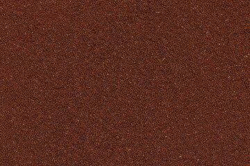 Ground coffee surface. The texture of the ground coffee. 