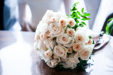 classic wedding bouquet of the bride in bright colors white roses and greenery