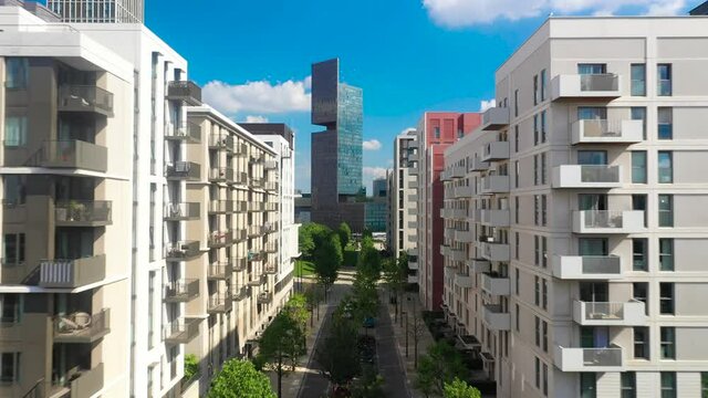 Street lined with residential houses, housing estate with green nature areas