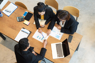 Top View Startup diversity teamwork brainstorming meeting concept. Business young multiethnic team working and planning Start Up in modern office.