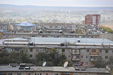 Zhezkazgan, Kazakhtan - 10.10.2016 : Residential buildings, commercial buildings and courtyards along the central streets of the city.
