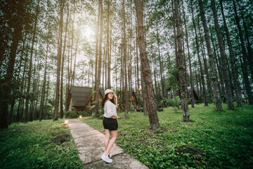 Winter travel relax vacation,Portrait Asian female tourist in white dress with hat stands in...