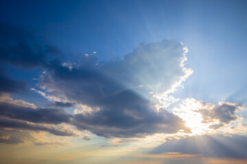 Fototapeta na wymiar dramatic sunset over dense cloudy sky
