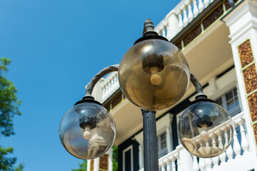 the white street lamp is turned off in the Park during the day. autumn sky.