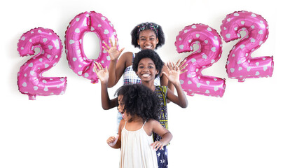 Dark skinned kids smile and waving hands, metallic pink number balloons on wall, 2022 Happy new year, white background