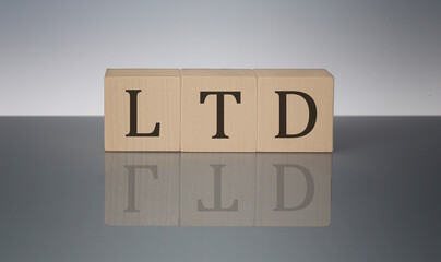 LTD concept, wooden word block on the grey background