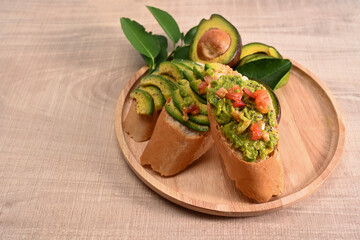 Fresh sliced avocado on rye bread. Healthy food.