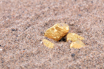 The exposed part of the gold mine buried in the sand