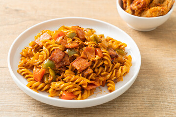 fusilli pasta with ham and tomatoes sauce