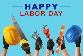 Hands of workers with different tools on color background with text HAPPY LABOR DAY