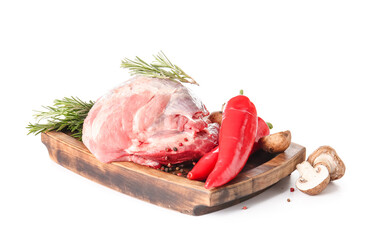 Board with raw pork meat, rosemary and vegetables on white background