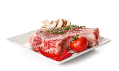 Plate with slice of raw pork rib, thyme and vegetables on white background