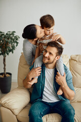 Young family enjoys the time they spend together at home.