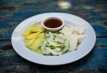 Indonesian fruit salad or rujak. Traditional fruit salad with peanut sauce