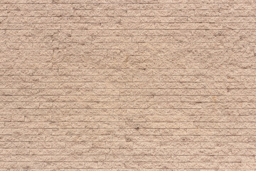 Light orange color brick wall close up image row brick and cement block background and texture