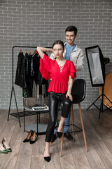 Fototapeta na wymiar Male stylist working with model in studio