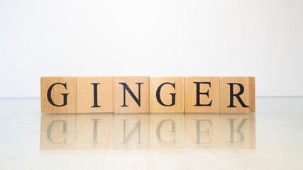 The word Ginger was created from wooden letter cubes. Gastronomy and spices.