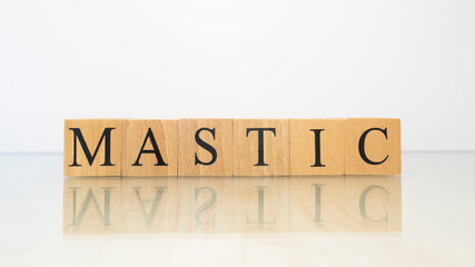 The word Mastic was created from wooden letter cubes. Gastronomy and spices.