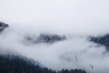 Foggy mountain landscape with gondola of a ski resort
