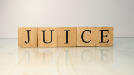 The word Juice was created from wooden letter cubes. Drinks and flavors.