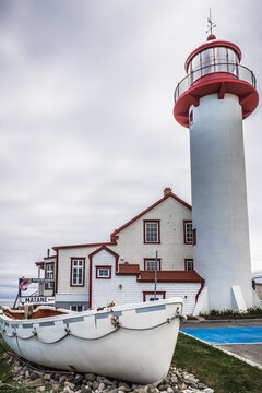 View on Matane's lighthouse, a red and white lighthouse located on the Northern shore of the Gaspesie peninsula, in the Bas Saint Laurent administrative region (Quebec, Canada)