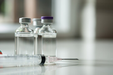 Selective Focus of Syringe and Medicine in vial , ready for vaccine injection , Cancer Treatment , Pain Treatment and can also be abused for an illegal use, healthcare and medical concept vaccination.