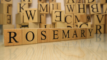 The word Rosemary was created from wooden letter cubes. Gastronomy and spices.