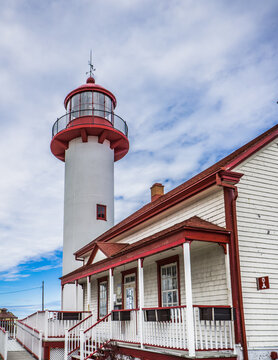 View on Matane's lighthouse, a red and white lighthouse located on the Northern shore of the Gaspesie peninsula, in the Bas Saint Laurent administrative region (Quebec, Canada)