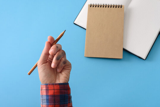 Dirty Left Hand In Red Shirt After Writing. Left Hander Day Concept.