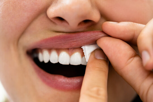 Woman Chewing Wet Moist Nicotine Product
