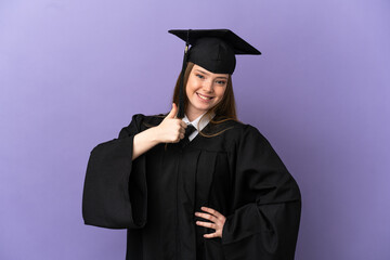 Young university graduate over isolated purple background giving a thumbs up gesture