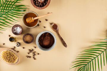 Ingredients for making homemade coffee skincare scrub on plain natural background. Eco friendly cosmetics, copy space for text