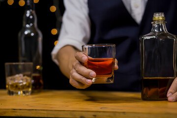 Bartender Serve Whiskey, on wood bar, 