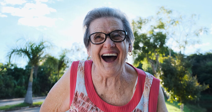 Smiling Old Latin Woman. Beautiful Senior Woman Looking At The Camera With A Warm Friendly Smile And Attentive Expression. Elderly Woman Laughing.