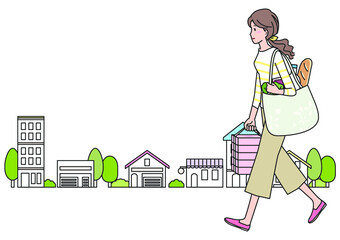 買い物帰りに街なかを歩く若い女性