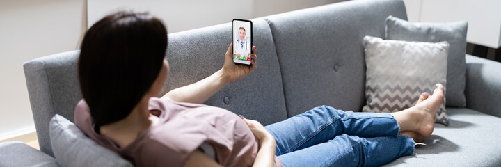 Pregnant Woman Using Online Video Call With Doctor