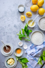 Ingredients for making traditional homemade lemon cake, fresh summer baking items