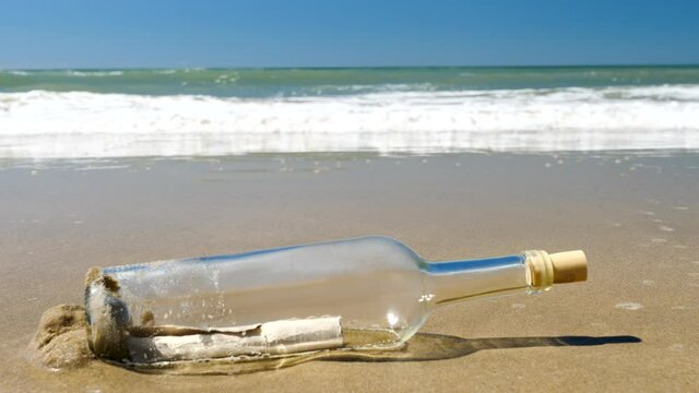 bottle with message on the beach