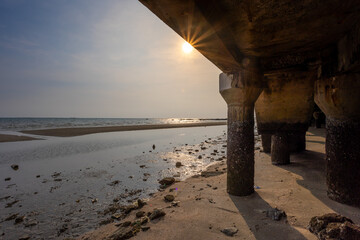 Under the walkway of Bangsaen Beach in the evening time, very few people because of the Covid-19 situation - obrazy, fototapety, plakaty