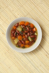 Top view of a bowl of Sop Senerek (Indonesian Red Bean Soup). Traditional soup from Magelang, Central Java