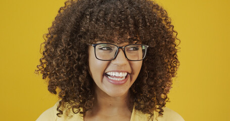 Young Latin woman with curly hair happy with her glasses. Eye care concept.