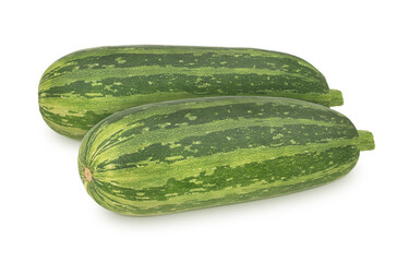 Vegetable composition with whole fresh zucchini isolated on a white background.