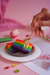 a plate of slices of rainbow cake