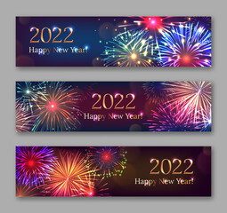 Happy New Year banners set with fireworks bursting. 2022 Merry Christmas horizontal dark festive backgrounds with shiny golden congratulatory text