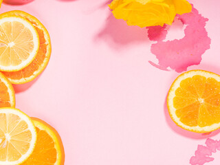 Summer vibe orange citrus slice fruit texture background on pastel pink with wet spots