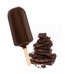 Chocolate popsicle stick ice cream and dark chocolate pieces stack on white background.