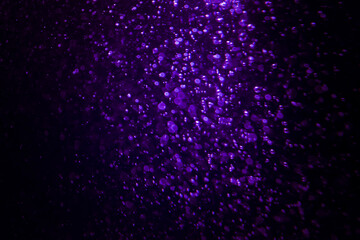 Purple bokeh abstract with black background