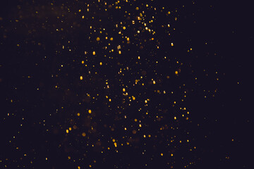 Golden bokeh of lights with black background