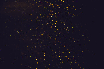 Fototapeta na wymiar Golden bokeh of lights with black background